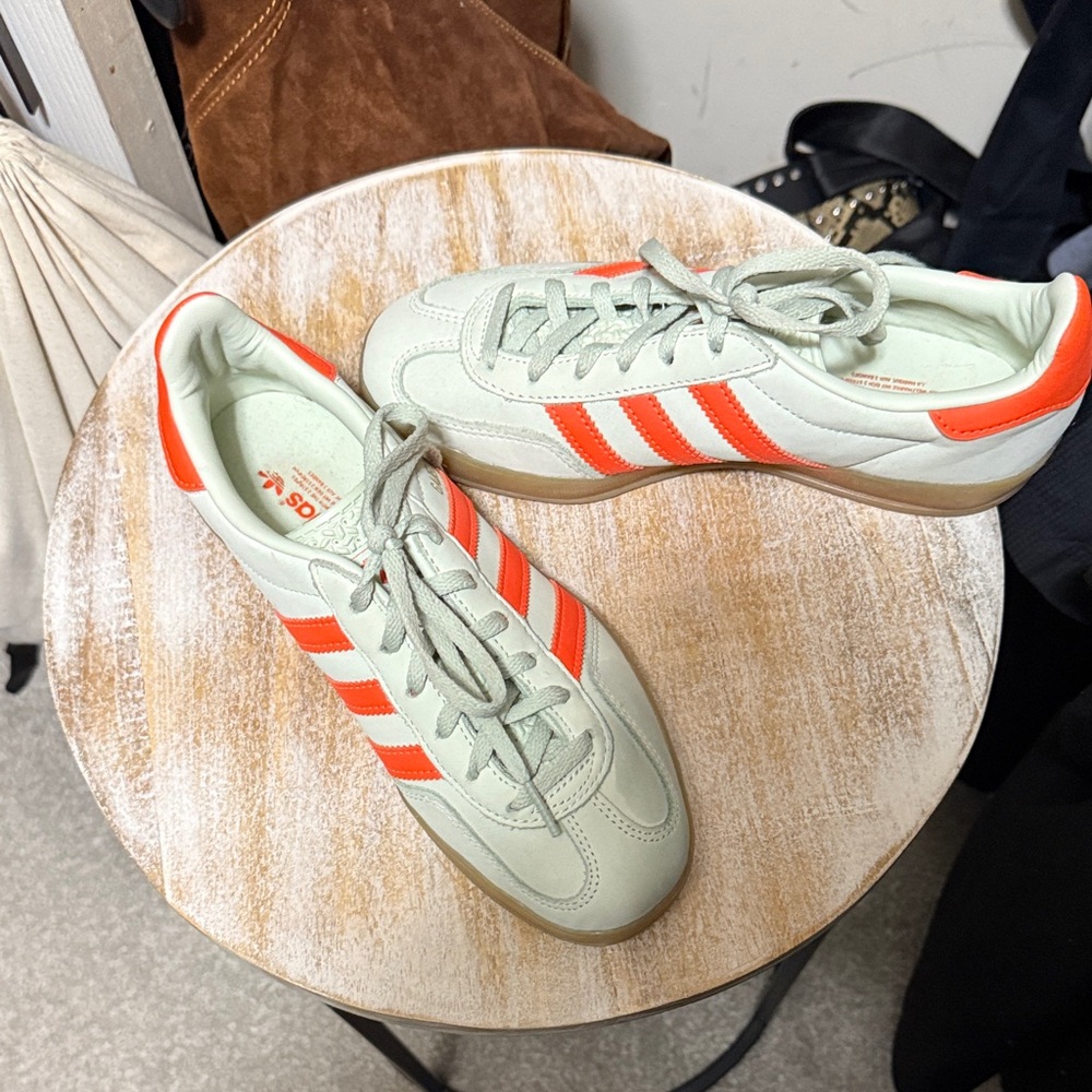 Adidas Mint Green Sneakers with Bold Orange Stripes